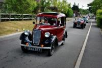 The classic cars in procession through the village in 2010 - picture courtesy of Tom Kalus